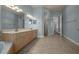 Bright bathroom with tile floors, double vanity with great lighting, and a glass enclosed shower at 4735 Se 35Th St, Ocala, FL 34480