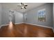 Bright bedroom with hardwood floors, large windows, and a ceiling fan at 4735 Se 35Th St, Ocala, FL 34480