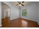 Cozy bedroom featuring hardwood floors and a window overlooking the lush outdoors at 4735 Se 35Th St, Ocala, FL 34480