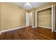 Bedroom featuring hardwood floors, a closet, and ample space at 4735 Se 35Th St, Ocala, FL 34480