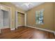 Bedroom featuring hardwood floors, closet, and window at 4735 Se 35Th St, Ocala, FL 34480
