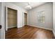 Bedroom with two closets, ceiling fan and window at 4735 Se 35Th St, Ocala, FL 34480