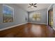 Spacious bedroom boasting hardwood floors, natural light, and sliding glass door at 4735 Se 35Th St, Ocala, FL 34480