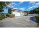 Spacious driveway leading to a two-car garage with a well-maintained yard at 4735 Se 35Th St, Ocala, FL 34480