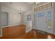 Elegant foyer with hardwood floors, decorative lighting, and a stylish front door at 4735 Se 35Th St, Ocala, FL 34480
