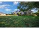Beautiful single-story house with green lawn and manicured shrubbery at 4735 Se 35Th St, Ocala, FL 34480