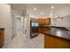 Spacious kitchen featuring wooden cabinets, stainless steel refrigerator, and tiled floors at 4735 Se 35Th St, Ocala, FL 34480
