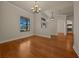 Spacious living room with hardwood floors, chandelier, and entry views at 4735 Se 35Th St, Ocala, FL 34480