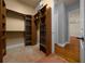 Spacious walk-in closet featuring custom shelving, ample hanging space, and organized storage baskets at 4735 Se 35Th St, Ocala, FL 34480