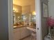 Bathroom with granite countertop vanity and big mirror provides a functional space at 6239 Sw 98Th Loop, Ocala, FL 34476