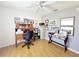 Well-lit home office featuring a traditional wooden desk and filing cabinet, ideal for work or study at 6239 Sw 98Th Loop, Ocala, FL 34476