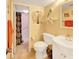 Charming bathroom with tiled floors, a shower, a toilet, and a sink vanity with decor at 700 Midway Dr # B, Ocala, FL 34472