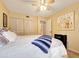 Airy bedroom boasts a ceiling fan and an adjacent closet, with an ample bed perfect for lounging at 700 Midway Dr # B, Ocala, FL 34472
