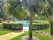 Gated community pool surrounded by lush greenery, offering a private and tranquil setting at 700 Midway Dr # B, Ocala, FL 34472