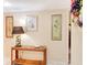 Inviting entryway featuring decorative artwork, a stylish lamp, and a floral accent at 700 Midway Dr # B, Ocala, FL 34472