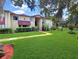 Apartment complex showcases meticulous landscaping, vibrant shrubbery, and a healthy green lawn at 700 Midway Dr # B, Ocala, FL 34472