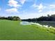 Expansive green space meeting a tranquil lake, highlighting natural beauty and recreational opportunities at 700 Midway Dr # B, Ocala, FL 34472