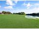 Expansive green space leading to a tranquil lake, perfect for outdoor activities and relaxation at 700 Midway Dr # B, Ocala, FL 34472