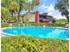 Inviting community pool with lounge chairs and well-maintained landscaping at 700 Midway Dr # B, Ocala, FL 34472
