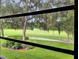 The view from the interior with lots of lush green trees at 700 Midway Dr # B, Ocala, FL 34472