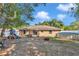 Spacious backyard featuring a deck, above-ground pool, and play set at 72 Dogwood Loop, Ocala, FL 34472