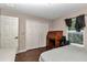 Small bedroom featuring laminate floors, a window, a desk and a full sized bed at 72 Dogwood Loop, Ocala, FL 34472