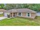 Charming home exterior with a well-maintained lawn at 72 Dogwood Loop, Ocala, FL 34472