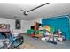Spacious garage with blue brick accent wall, with miscellaneous contents and decor at 72 Dogwood Loop, Ocala, FL 34472
