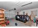 View of the garage with black sofa and equipment at 72 Dogwood Loop, Ocala, FL 34472