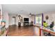 Spacious living room featuring wood floors, a ceiling fan, and lots of natural light at 72 Dogwood Loop, Ocala, FL 34472