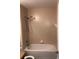 A tiled bathtub and shower combination bathroom with standard fixtures at 77 Dogwood Drive Pass, Ocala, FL 34472