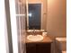 Bathroom featuring a vanity with a white sink, adjacent to a toilet at 77 Dogwood Drive Pass, Ocala, FL 34472