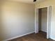 A simple bedroom featuring tile floors and an open closet ready for storage at 77 Dogwood Drive Pass, Ocala, FL 34472