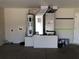 Spacious garage featuring a modern water heater and air conditioning system for climate control and convenience at 77 Dogwood Drive Pass, Ocala, FL 34472