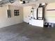 Spacious garage with utilities offers functionality and ample space for parking and storage solutions at 77 Dogwood Drive Pass, Ocala, FL 34472