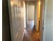 Hallway showing tile floors and white doors leading to multiple rooms at 77 Dogwood Drive Pass, Ocala, FL 34472