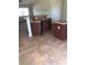 An open kitchen layout featuring tile floors, an island, and sink with counter at 77 Dogwood Drive Pass, Ocala, FL 34472