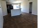 The living room and kitchen features neutral walls and tile flooring at 77 Dogwood Drive Pass, Ocala, FL 34472