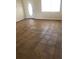 The living room has tile floors and a bright sunny window at 77 Dogwood Drive Pass, Ocala, FL 34472