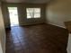 The living room has tile floors, a large window, and an open entryway at 77 Dogwood Drive Pass, Ocala, FL 34472