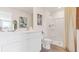 Bright bathroom featuring double vanity sinks, a walk-in shower, and neutral tiling at 8407 Gower Trl, Wildwood, FL 34785