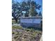 Entrance sign for Twisted Oaks Reserve community, set against a backdrop of mature trees at 8407 Gower Trl, Wildwood, FL 34785