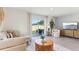 Comfortable living room with plush seating, a large sliding door, and an open layout for modern living at 8411 Gower Trl, Wildwood, FL 34785