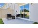 Cozy outdoor patio with stylish furniture is perfect for relaxing and enjoying the outdoors at 8413 Gower Trl, Wildwood, FL 34785