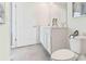 This bathroom features a neutral color palette with a dual sink vanity, providing a refreshing and clean aesthetic at 8419 Gower Trl, Wildwood, FL 34785