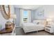 This bedroom features neutral paint and a light wood dresser, creating a calming and inviting space at 8419 Gower Trl, Wildwood, FL 34785