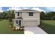 Charming two-story home features a neutral color palette, an attached two-car garage, and a well-manicured lawn at 8486 Las Palmas Way, Wildwood, FL 34785