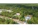 Aerial view of the property showcasing its placement amongst the trees at 8498 Sw 129Th Terrace Rd, Dunnellon, FL 34432