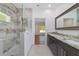 Bathroom featuring a walk-in shower, large vanity and a large mirror at 8498 Sw 129Th Terrace Rd, Dunnellon, FL 34432