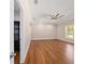 Large bedroom with hardwood floors, ceiling fan, a walk-in closet and natural light at 8498 Sw 129Th Terrace Rd, Dunnellon, FL 34432